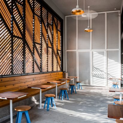 Official designs light-filled cafe and dark cocktail bar in Dallas
