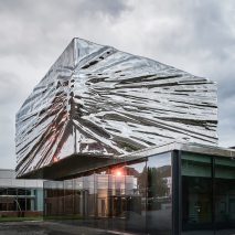 Snøhetta adds crinkled stainless-steel extension to 1960s museum in Norway