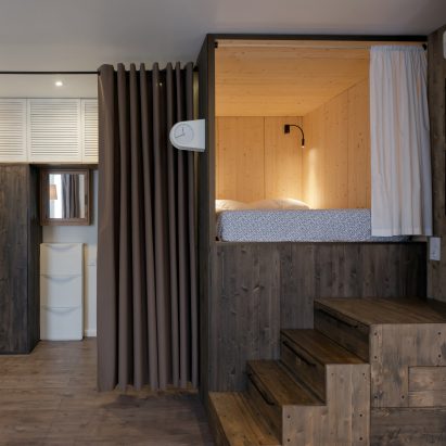 Studio Bazi’s tiny self-designed home features a wooden “sleeping box”