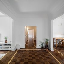 Aboim Inglez Arquitectos overhauls 1930s apartment in Lisbon with wooden parquet and grey marble