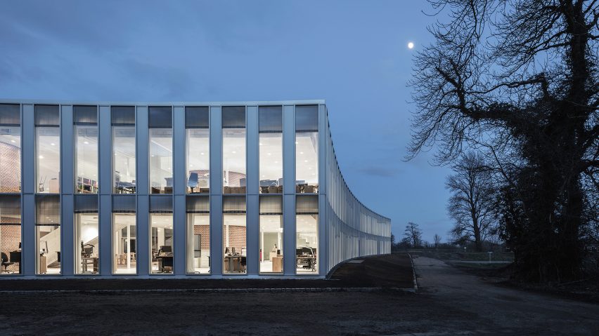 Sleth extends postmodern town hall in Denmark with curving glass volumes