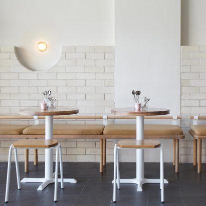 White brick and reclaimed eucalyptus wood fill Sydney Dessert Kitchen