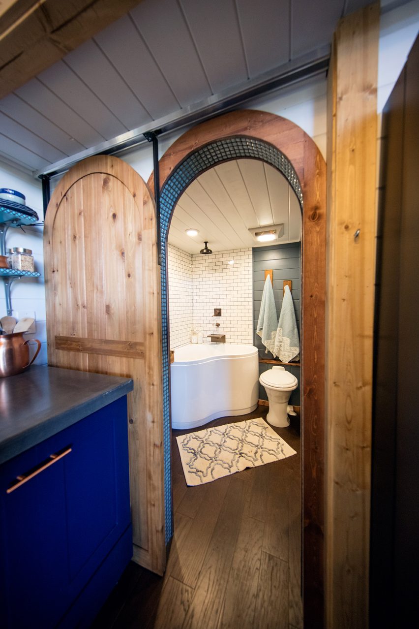 Cabin with climbing wall by Tiny Heirloom