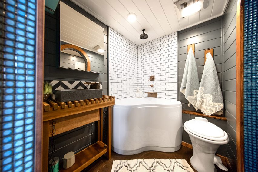 Cabin with climbing wall by Tiny Heirloom