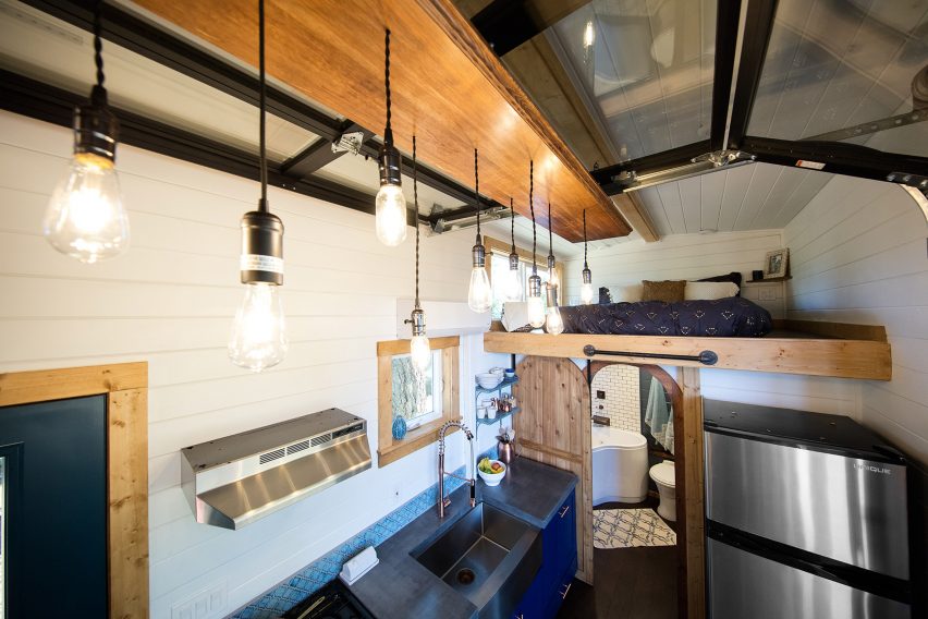 Cabin with climbing wall by Tiny Heirloom