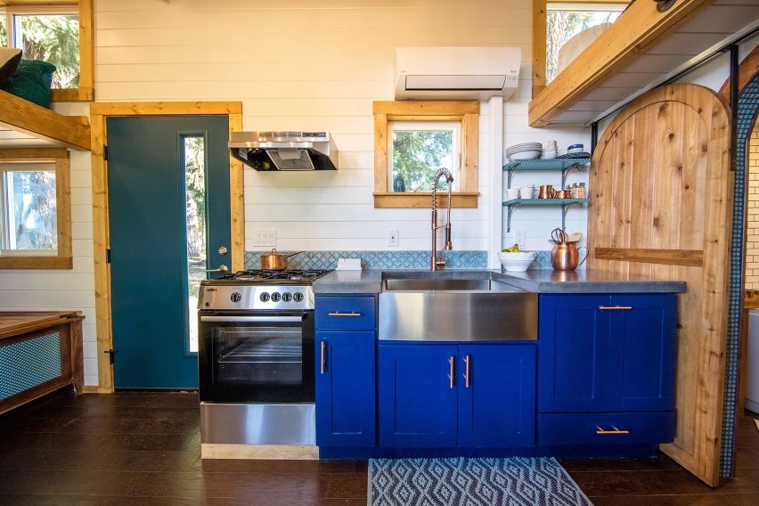 Cabin with climbing wall by Tiny Heirloom
