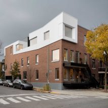 Naturehumaine upgrades Montreal residences with new brickwork and a white roof extension
