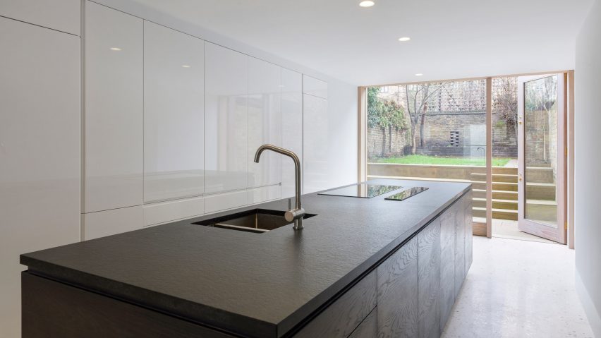 Gundry & Ducker adds sooty brick and glass extension to London house