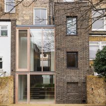 Gundry & Ducker adds sooty brick and glass extension to London house