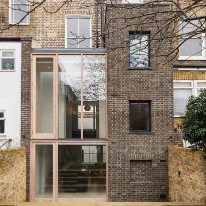 Gundry & Ducker adds sooty brick and glass extension to London house