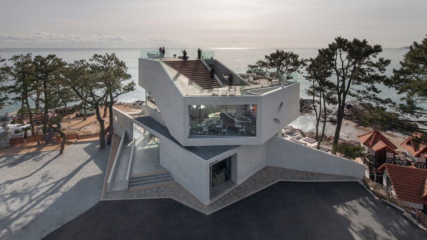 Stacked concrete blocks and roof deck give diners sea views from South Korean cafe