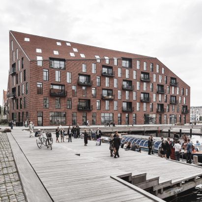 COBE and Vilhelm Lauritzen Architects complete warehouse-inspired housing for Copenhagen harbour