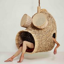 Porky Hefer exhibits human-sized nests made from woven plant stalks