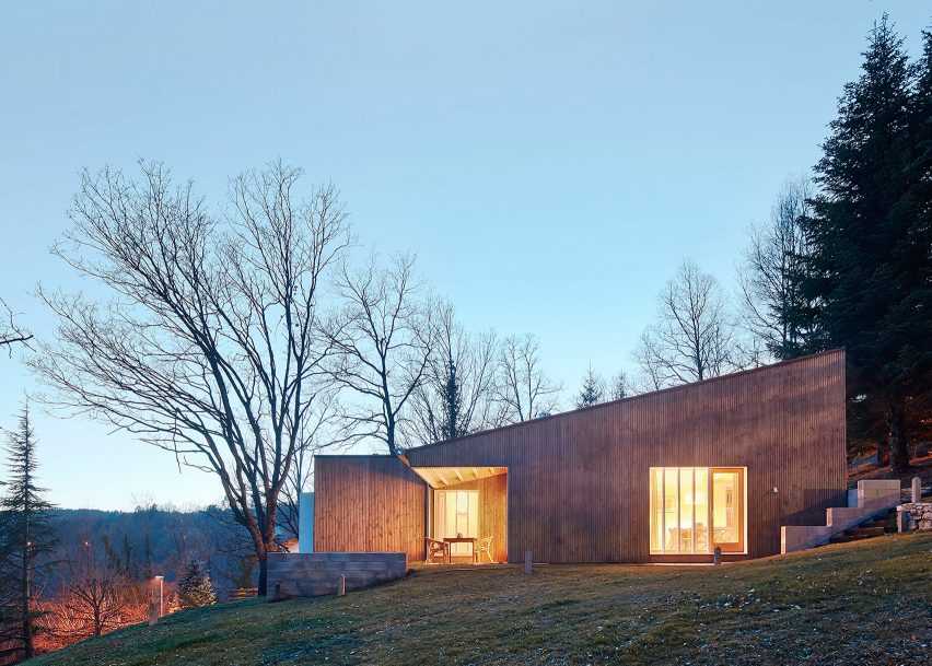 Marc Mogas slots prefab summer home into wooded slope in the Pyrenees