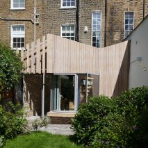 Pamphilon Architects’ larch-clad extension echoes butterfly roof of east London terrace