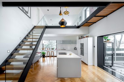 Peart/Weisgerber Residence at Habitat 67 by Moshe Safdie renovated by EMarchitecture Kitchen and Staircase