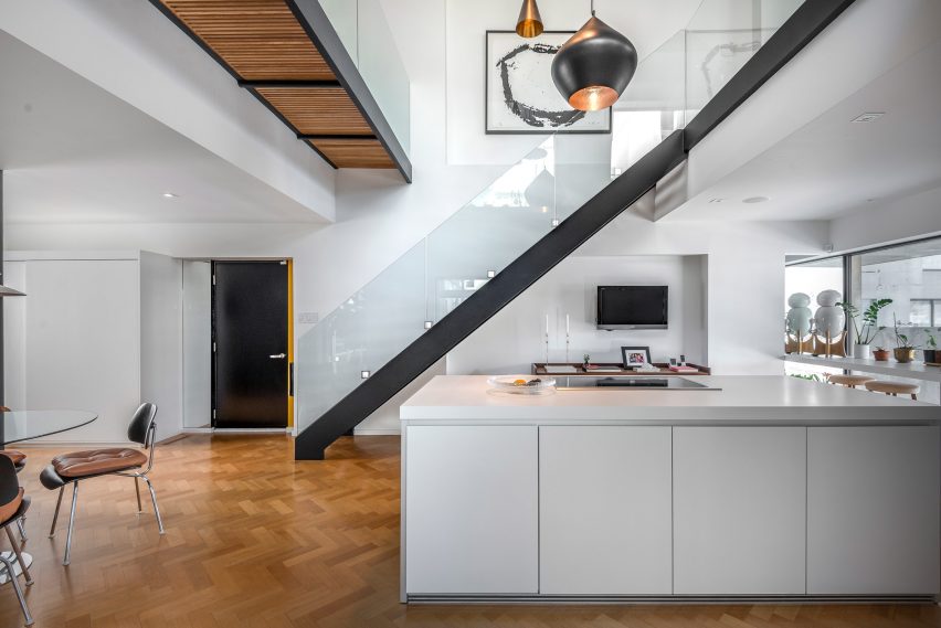 Peart/Weisgerber Residence at Habitat 67 by Moshe Safdie renovated by EMarchitecture Kitchen and Staircase Side View