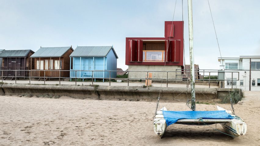 Red beach hut by Jonathan Hendry Architects stands atop former toilet block