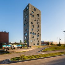 Angular openings puncture concrete facades of university tower by Morini Arquitectos
