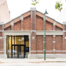 Cigarette factory in Brussels converted into city hall by trio of Belgian architects