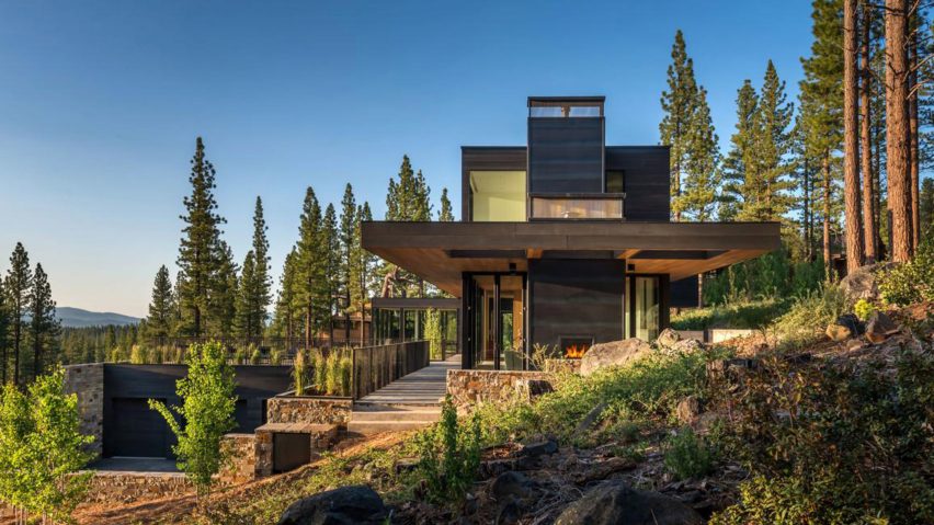 Californian home by Blaze Makoid steps down a forested hillside