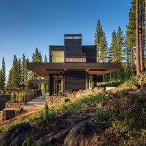 Californian home by Blaze Makoid steps down a forested hillside