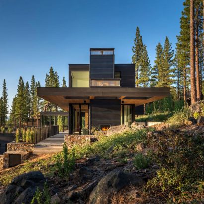 Californian home by Blaze Makoid steps down a forested hillside