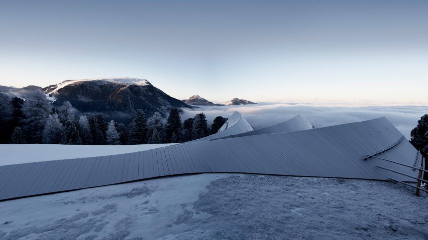 Three blackened wood huts project from mountain restaurant by Peter Pichler and Pavol Mikolajcak