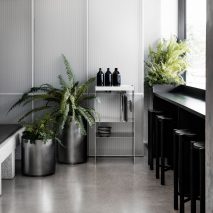 Concrete and terrazzo furniture feature in Ritz&Ghougassian’s minimal cafe interior