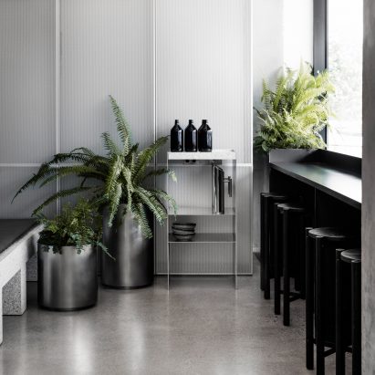 Concrete and terrazzo furniture feature in Ritz&Ghougassian’s minimal cafe interior
