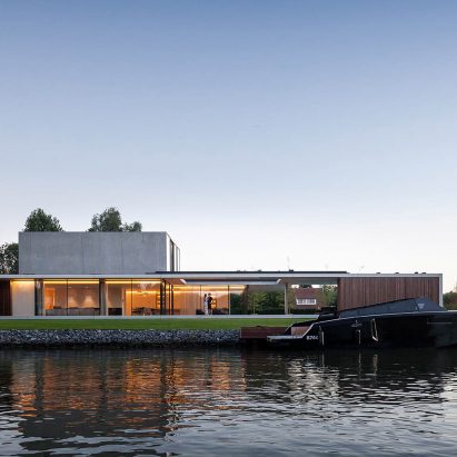 Govaert & Vanhoutte Architects creates bachelor pad with underground club on Ghent’s Leie river