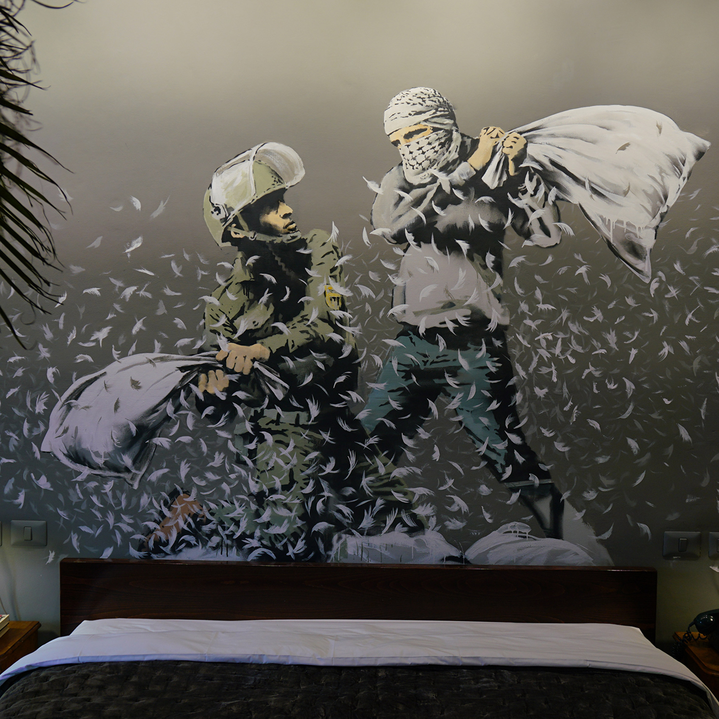 Banksy opens art-filled Walled Off Hotel along West Bank barrier