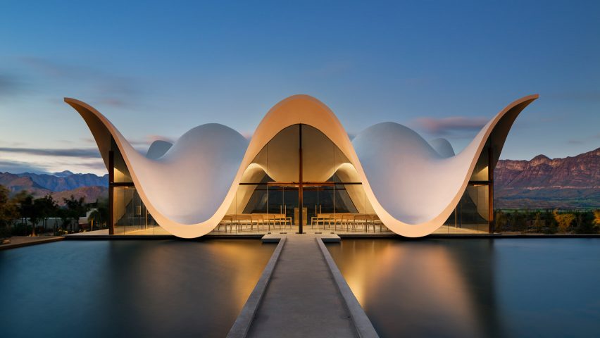 Steyn Studio’s chapel frames dramatic views of South African countryside below its sinuous roof