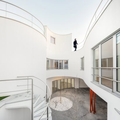 House L27 by dIONISO LAB is arranged around a curving courtyard in northern Portugal