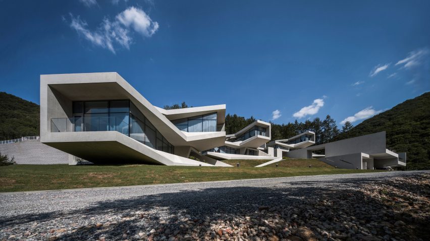 Concrete volumes cantilever and twist to provide mountain views from South Korean holiday resort