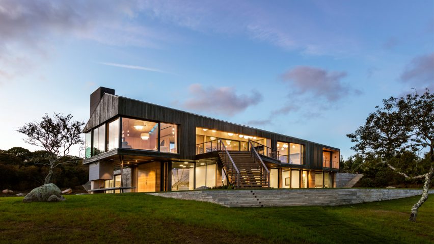 Massachusetts island home features walls of charred cedar and textured concrete