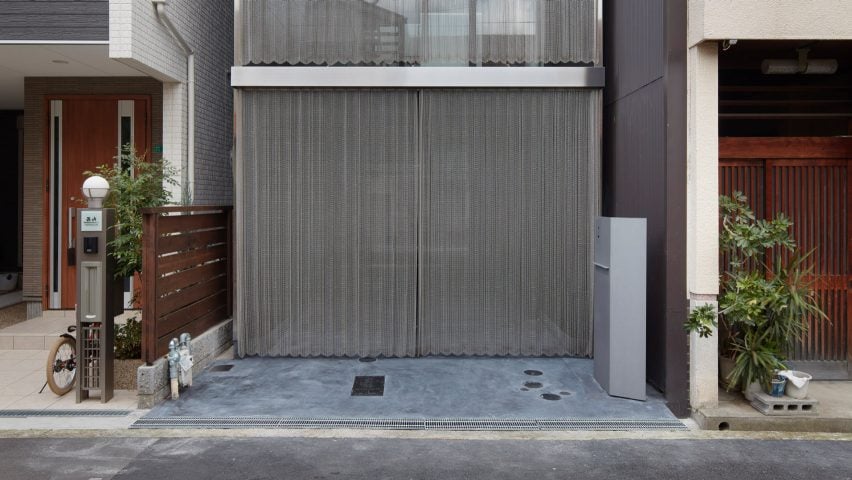 Steel chain curtains cover skinny Osaka house by FujiwaraMuro Architects