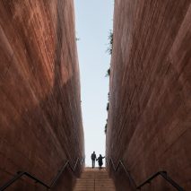 BBGK Architekci uses stained concrete walls to create Katyn Museum inside Warsaw barbican