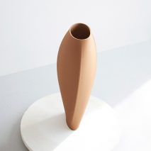 Olivier van Herpt designs 3D-printed clay vases based on latest COS fashion collection