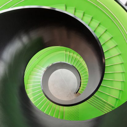 Reiulf Ramstad Arkitekter’s Cultural Center Stjørdal features a lime green spiral staircase
