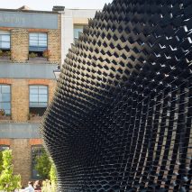 Giles Miller installs louvred plywood pavilion in London’s Clerkenwell