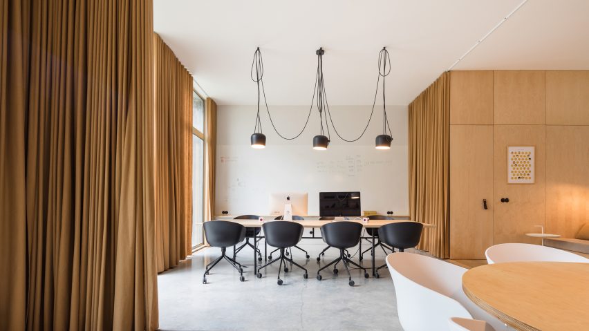 Curtains separate spaces of Lisbon office for a “hook-up app for awesome people”