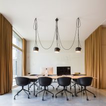 Curtains separate spaces of Lisbon office for a “hook-up app for awesome people”