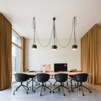 Curtains separate spaces of Lisbon office for a “hook-up app for awesome people”