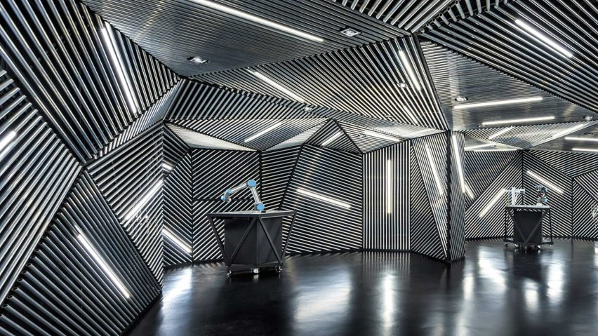 Ministry of Design creates robot training facility lined with metal and tube lights