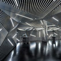 Ministry of Design creates robot training facility lined with metal and tube lights