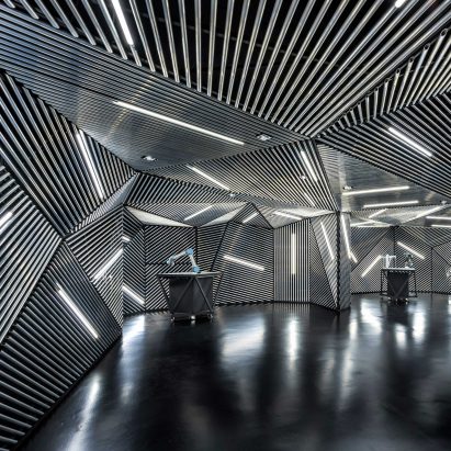Ministry of Design creates robot training facility lined with metal and tube lights