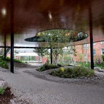 dRMM builds Oldham Maggie’s Centre around a courtyard with rippling glass walls
