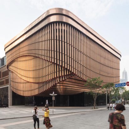 Foster and Heatherwick complete Shanghai theatre with curtain-like facade