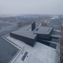 Sloping black volumes penetrate public square at Harbin’s Exhibition Hall of Crime Evidences